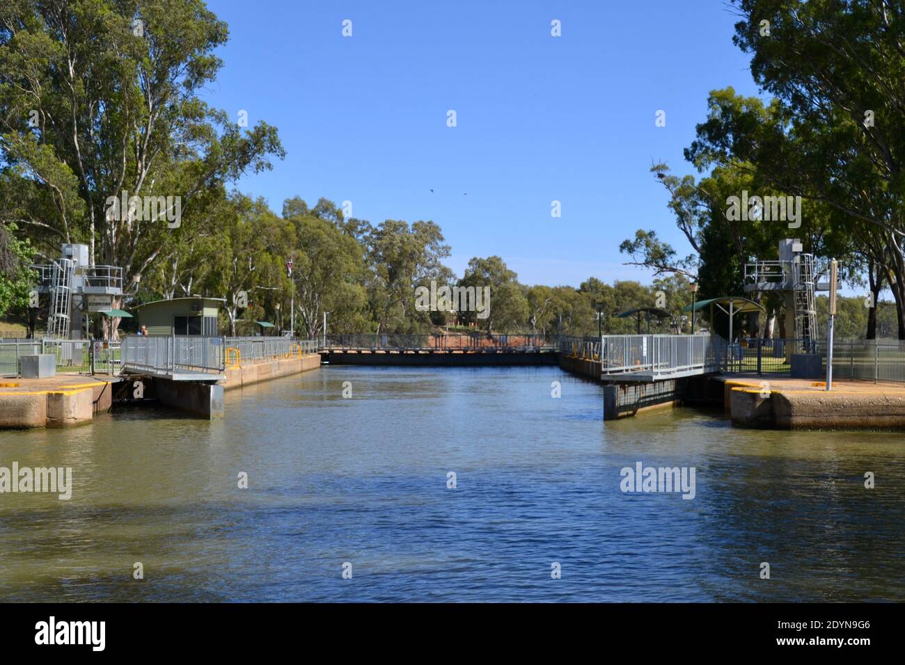 Opening gates on lock 11 managing the water river level and flow around the Mildura Weir in Australia Stock Photo