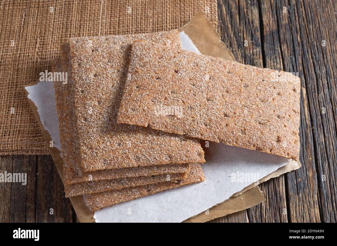 Stack rye crispbread on old wooden table. Dietary food Stock Photo - Alamy