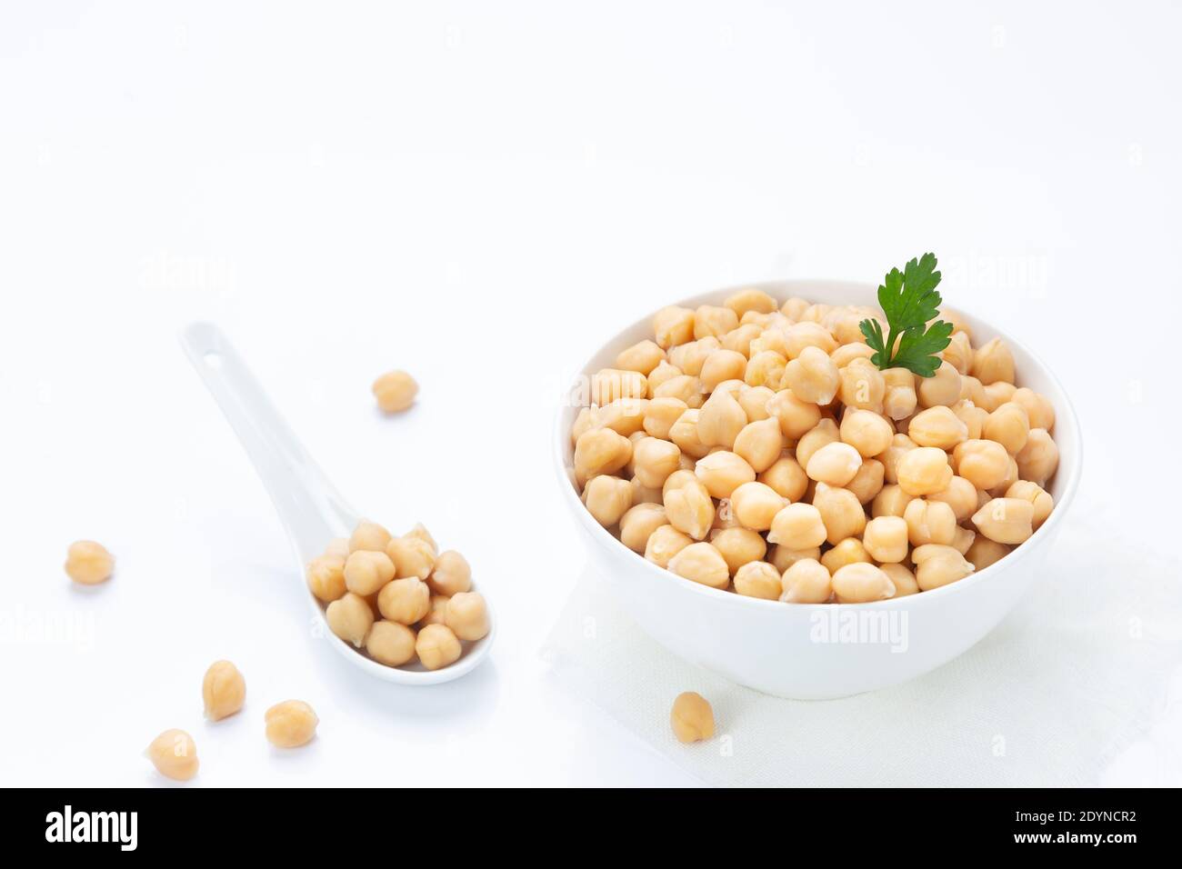 Chickpeas on  plate, isolated on  white background. Stock Photo