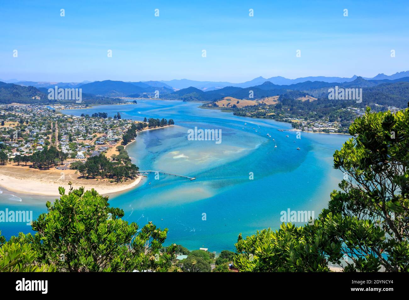 Two neighboring seaside towns on the Coromandel Peninsula, New Zealand. Pauanui (at left) and Tairua (right) are separated by a harbor Stock Photo