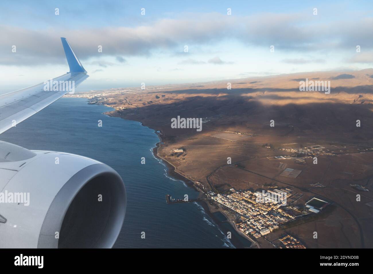 Aerial views of the island of Gran Canaria, and the wing of the plane from the window. Flights 