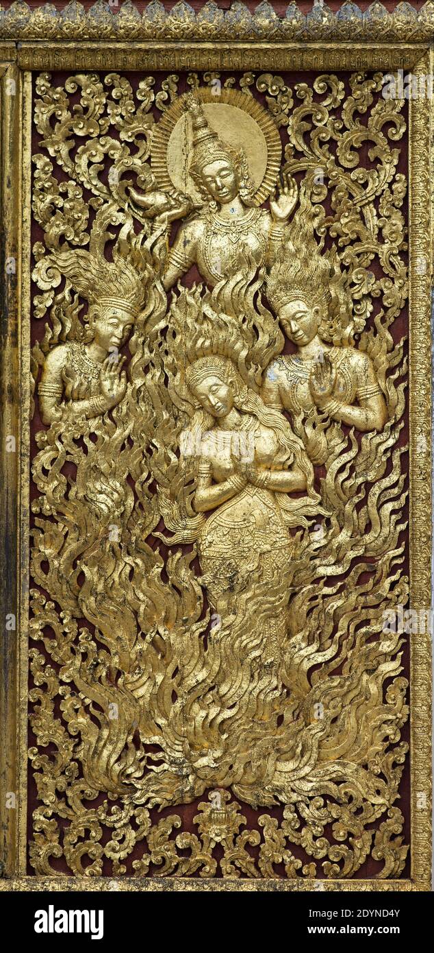 Sitas judgement by fire, carved gilded teak wood panel, Temple Wat Xieng Thong, Luang Prabang, Laos Stock Photo