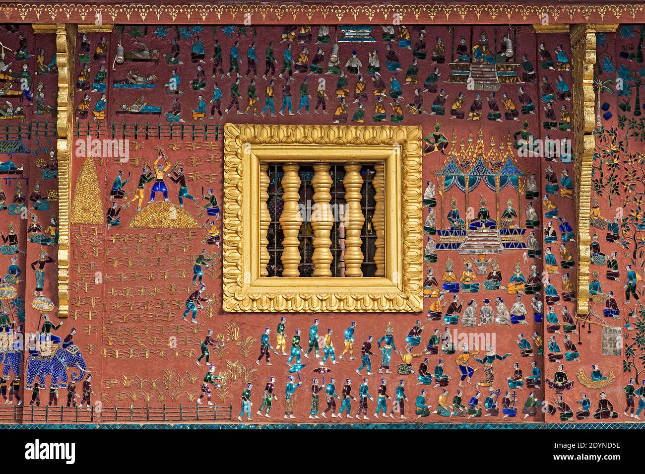 Brightly colored mosaic inlays  illustrating scenes of rural life at the Tripitaka Library, Temple Wat Xieng Thong, Luang Prabang, Laos Stock Photo