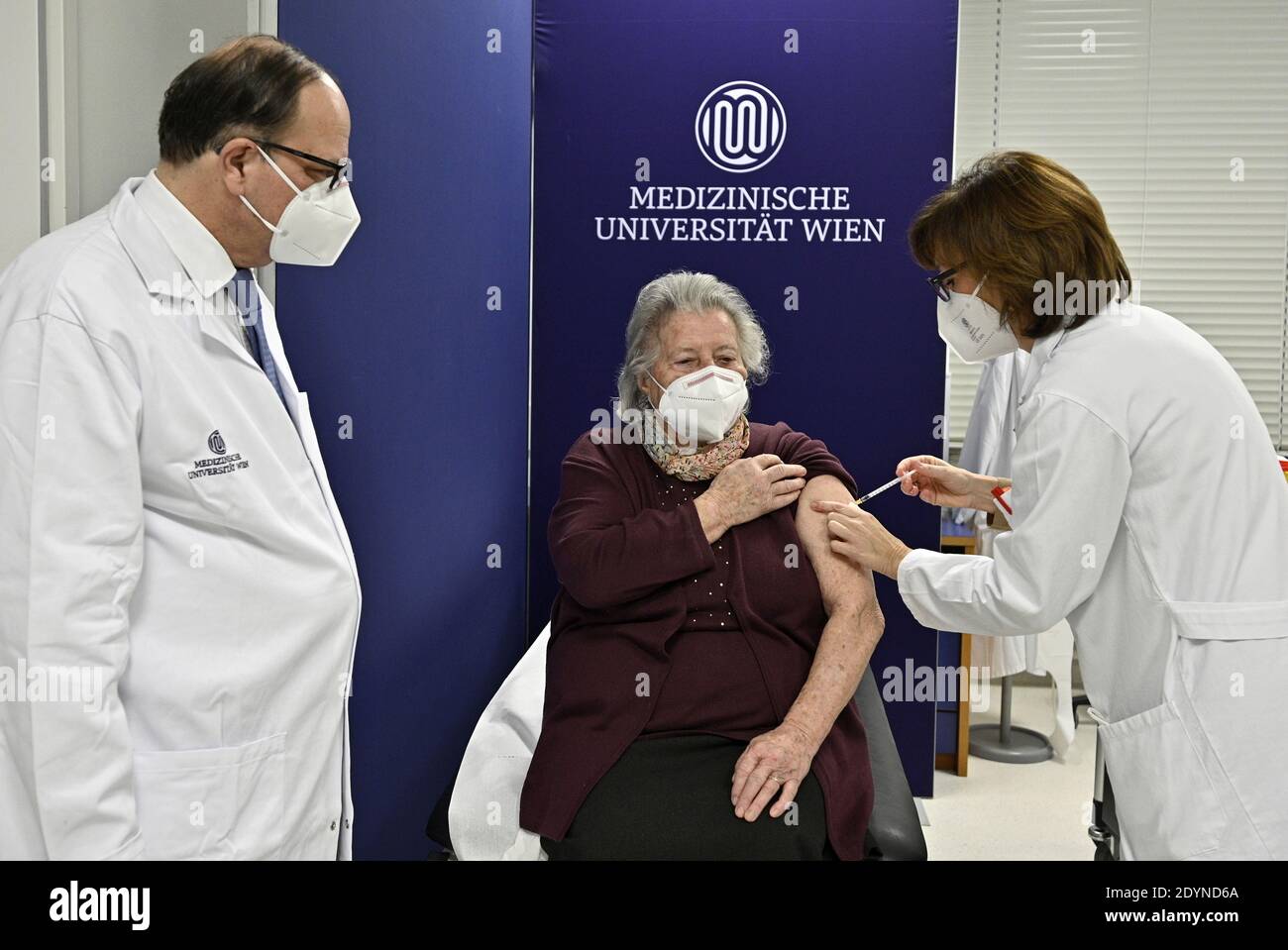 An elderly woman receives the first Pfizer/BioNTech COVID-19 vaccine at the MedUni Wien in Vienna, Austria December 27, 2020, the day when the country starts its vaccination programme. Hans Punz/Pool via Reuters Stock Photo