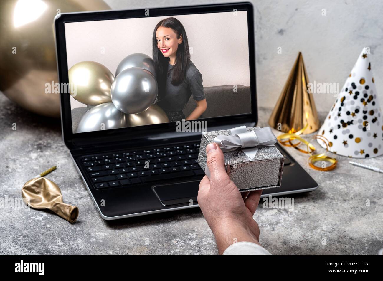 Birthday online Remote Celebration Concept. Man holding a festive gift