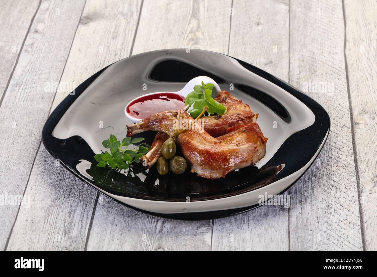 Robt Rabbit Leg Roasted rabbit legs with cowberry sauce Stock Photo - Alamy