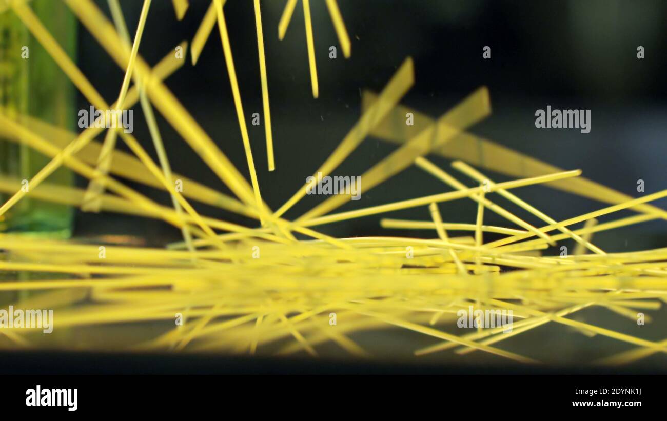 Falling Spaghetti on Table Stock Photo