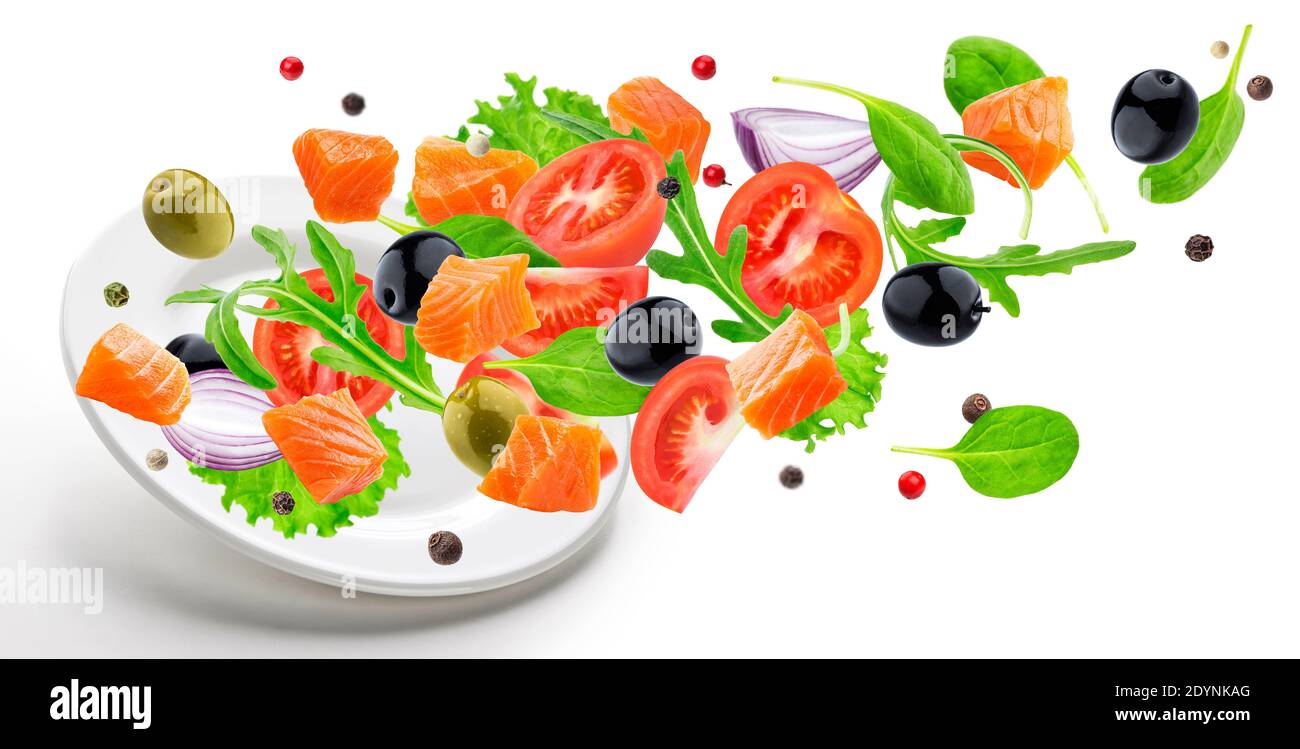 Flying salmon salad isolated on white background Stock Photo