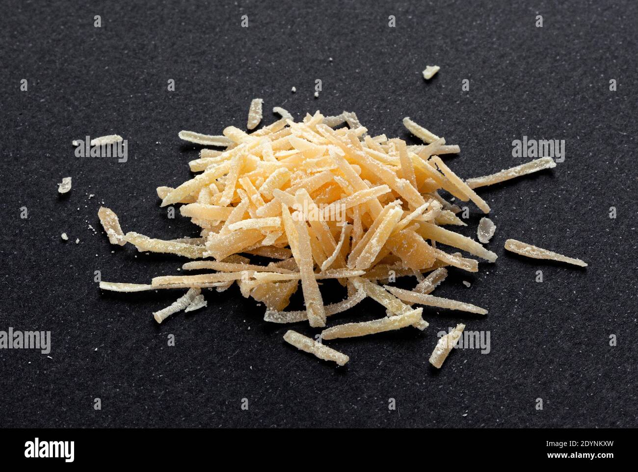 https://c8.alamy.com/comp/2DYNKXW/grated-parmesan-cheese-on-black-background-parmigiano-close-up-2DYNKXW.jpg