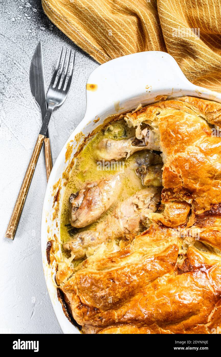 Hearty Homemade Chicken Pot Pie with Peas and Carrots. Gray background