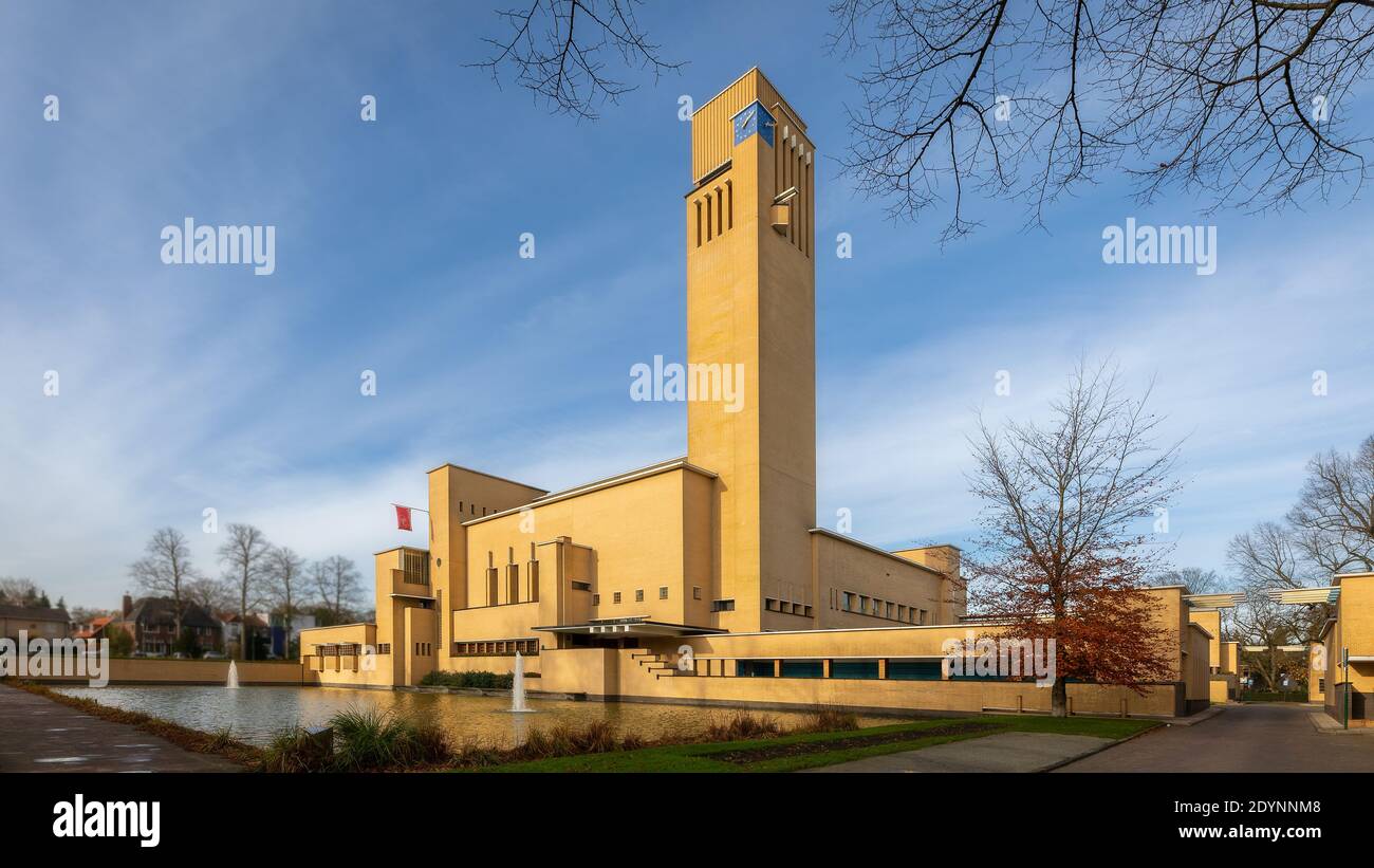 Hilversum, Netherlands - Novembre 22, 2020; town hall yellow brick architect Dudok famous style with fountain water Stock Photo