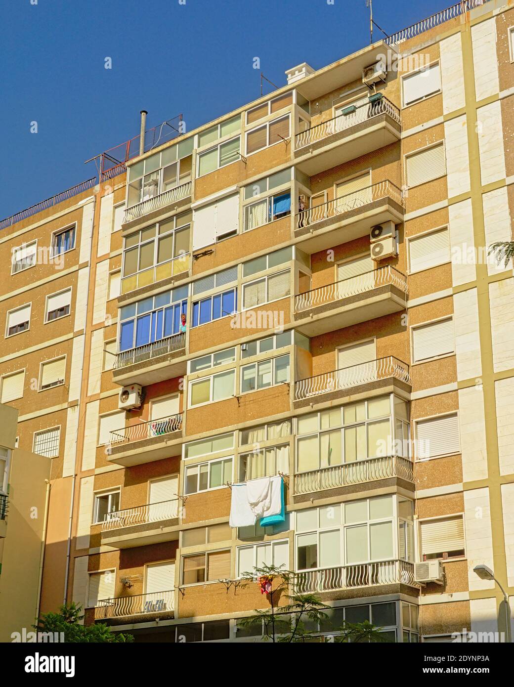 Facade of a typical apartment building in pastel colors in Lisbon ...