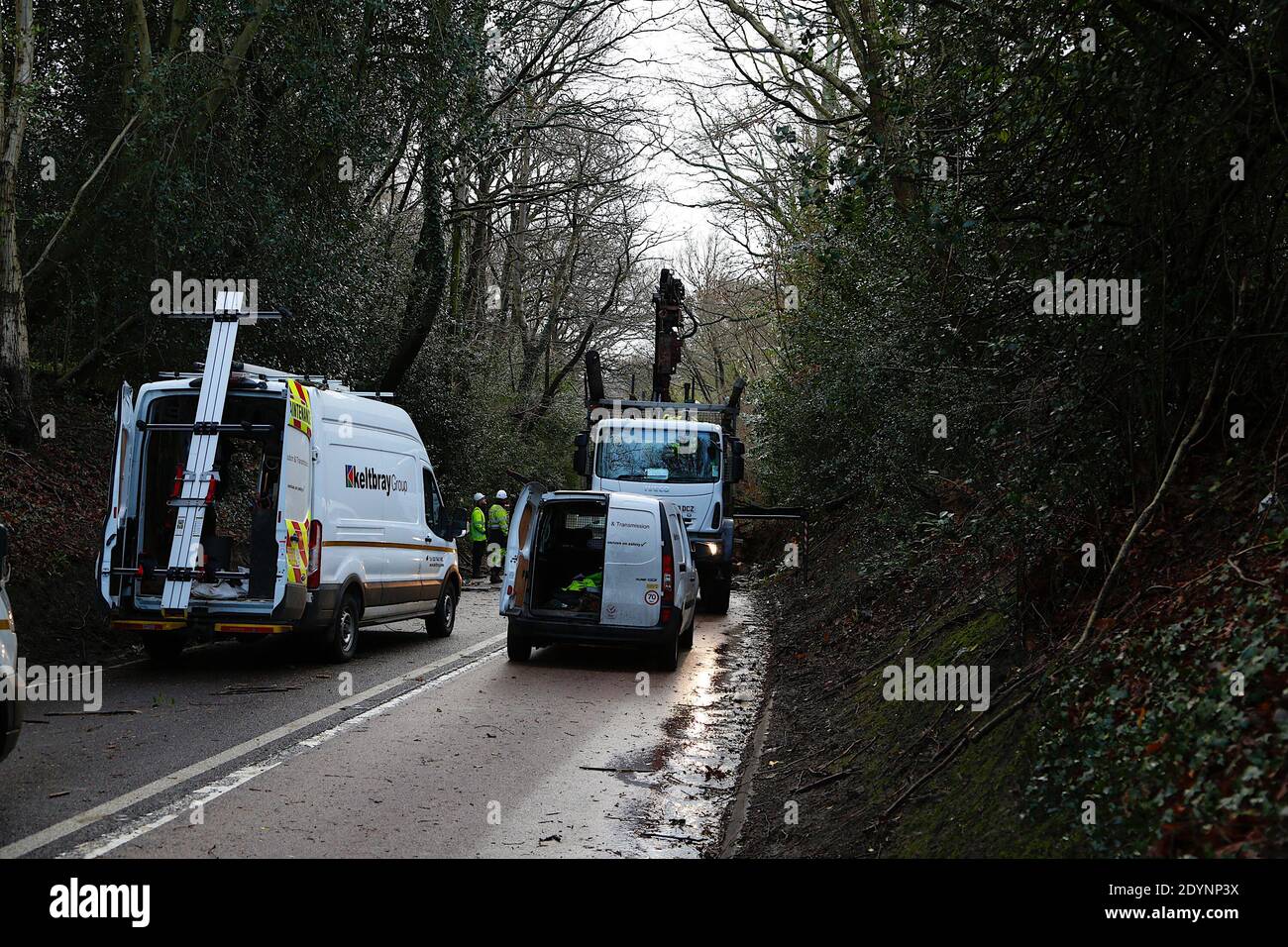 Hastings, East Sussex, UK. 27 Dec, 2020. UK Weather: The A21 from Hastings to Sedlescombe is blocked off by the police as storm Bella has blown down trees along the route. Trees have taken Power line down, according workmen they have several hours left to clear the road. Photo Credit: Paul Lawrenson/Alamy Live News Stock Photo
