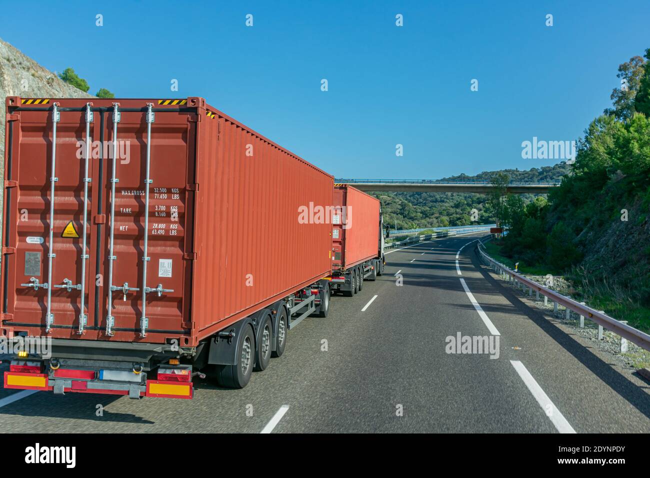 Euro-modular truck, road train or mega-truck with two 40-foot containers traveling on the highway. Stock Photo