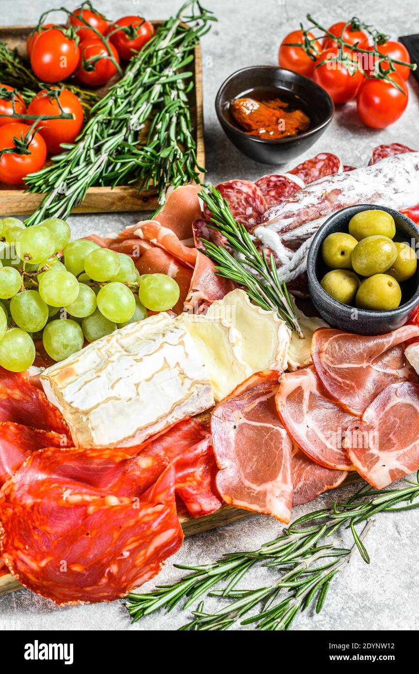 Antipasto set platter. Cold smoked meat plate with sausage, sliced ham