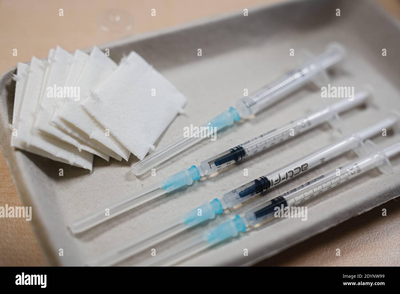 Bamberg, Germany. 27th Dec, 2020. Syringes raised with the Biontech/Pfizer coronavirus vaccine lie ready on a table. Corona vaccinations with the Biontech/Pfizer vaccine started in Germany on Sunday. Credit: Nicolas Armer/dpa/Alamy Live News Stock Photo