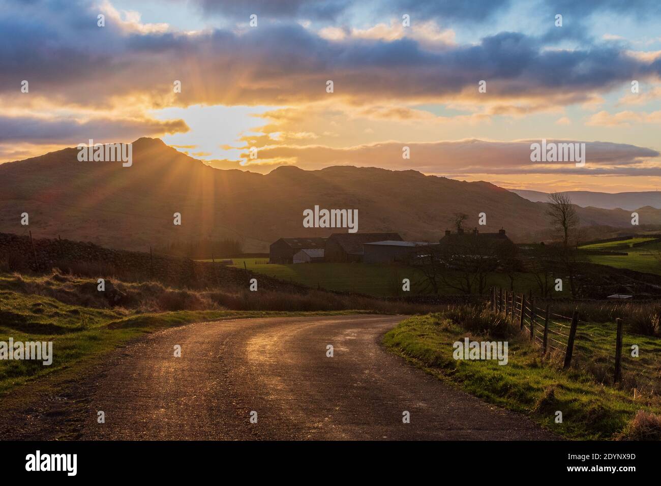 Sunrise over a beautiful road in the lake district Stock Photo