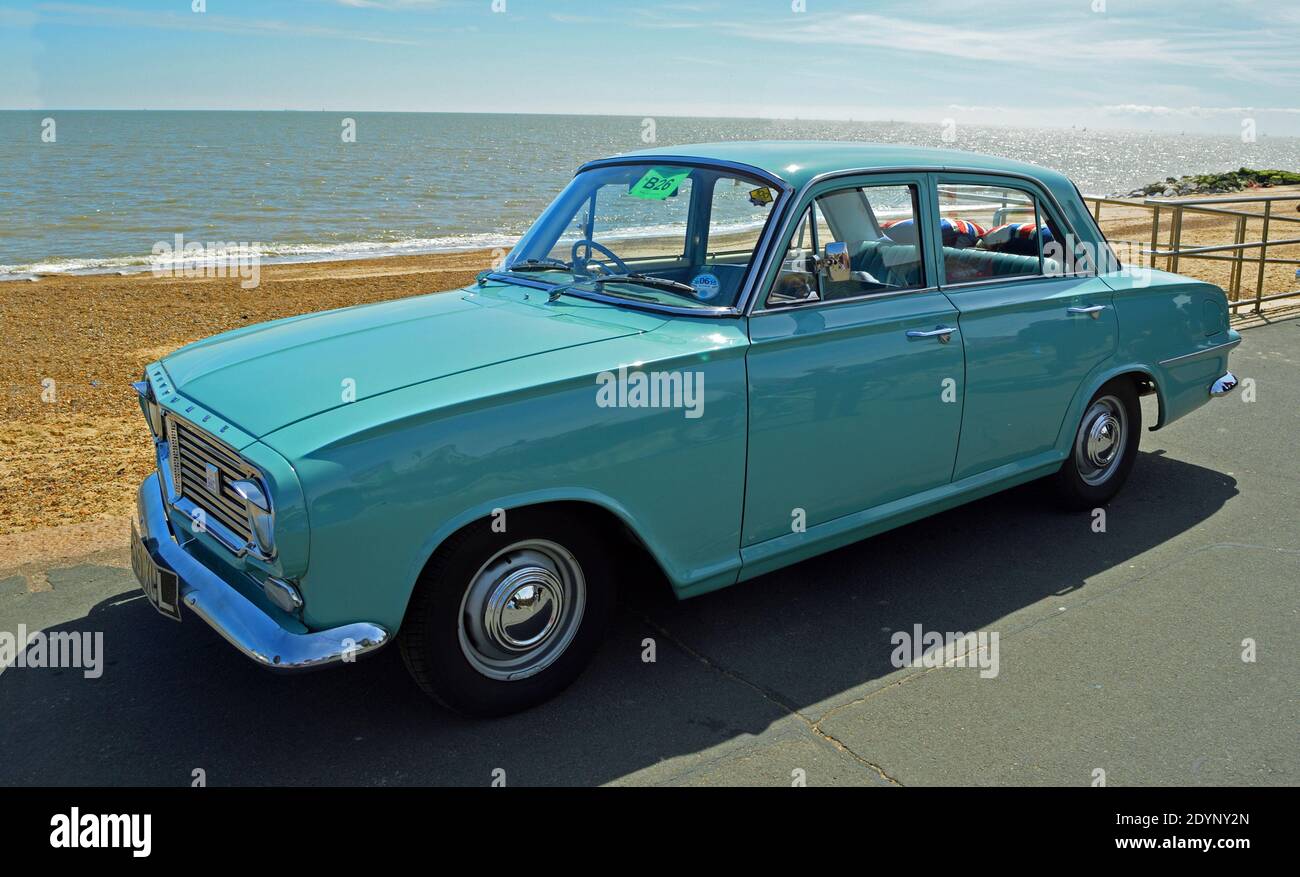 Classic Light Blue Vauxhall Victor car parked on seafront promenade. Stock Photo