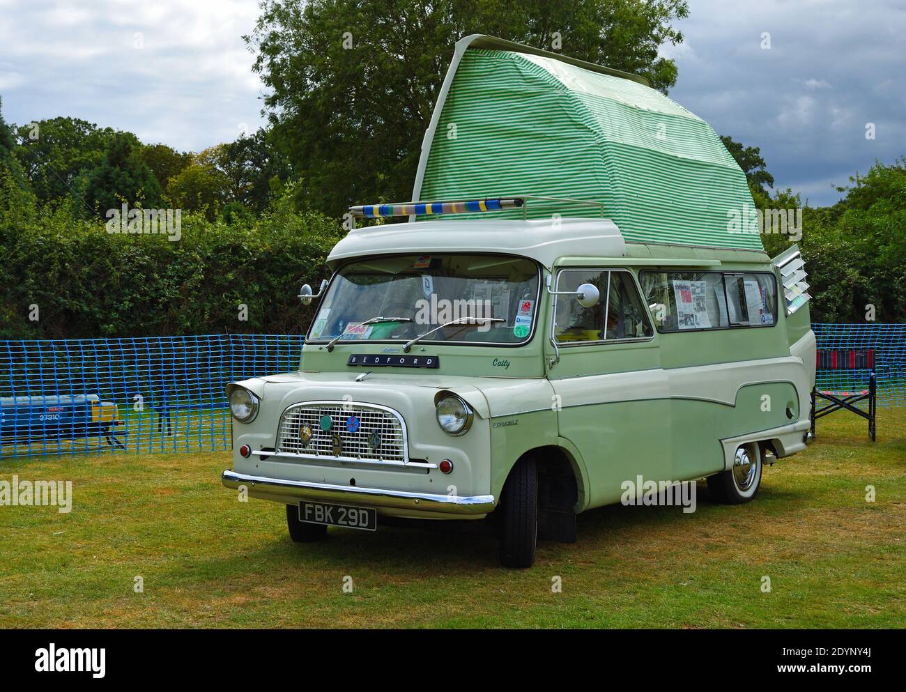 Classic Bedford Camper Van  parked in field with top up. Stock Photo