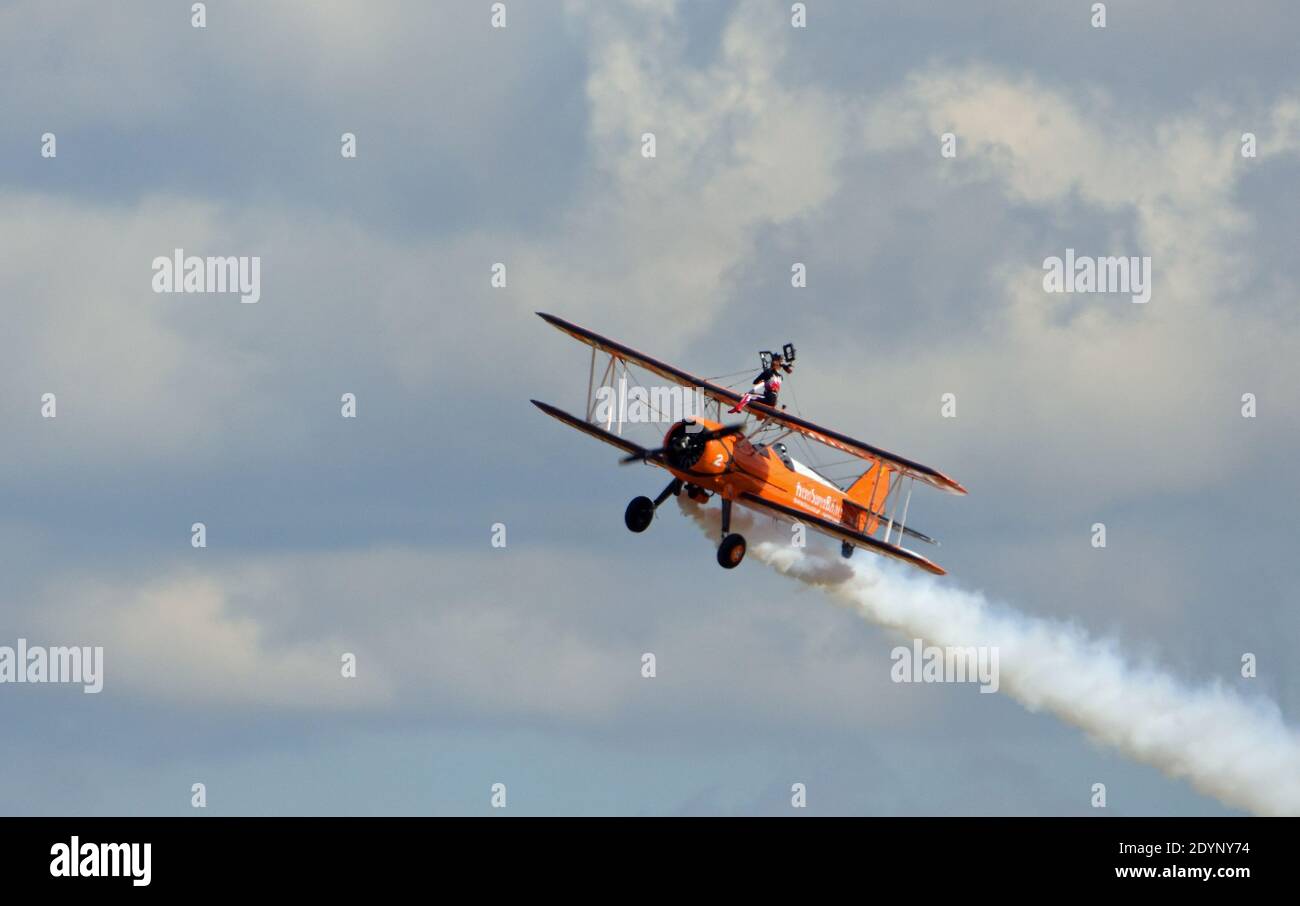 Aerosuperbatics wing walking display team aeroplane in flight. Wing walker. Stock Photo