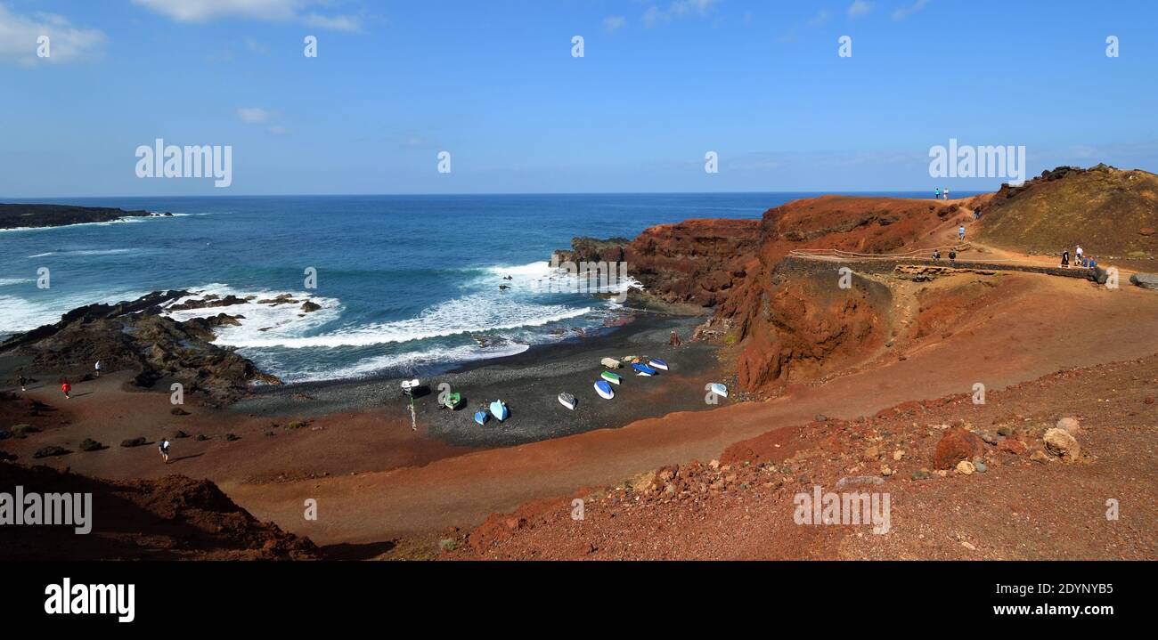 Panramic Volcanic Landscape of El Golfo Lanzarote  beach and small boats. Stock Photo