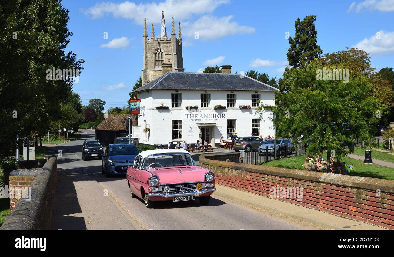 Classic  1959  Pink Vauxhall Cresta  PA  Car crossing historic packhorse bridge at Great Barford Bedfordshire England. Stock Photo