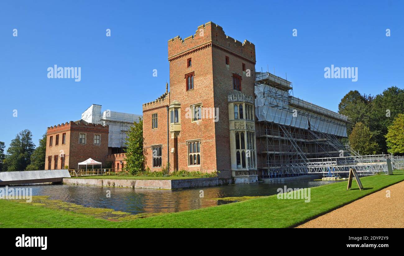 Oxburgh Hall under going roof repairs with scaffolding  and moat. Stock Photo