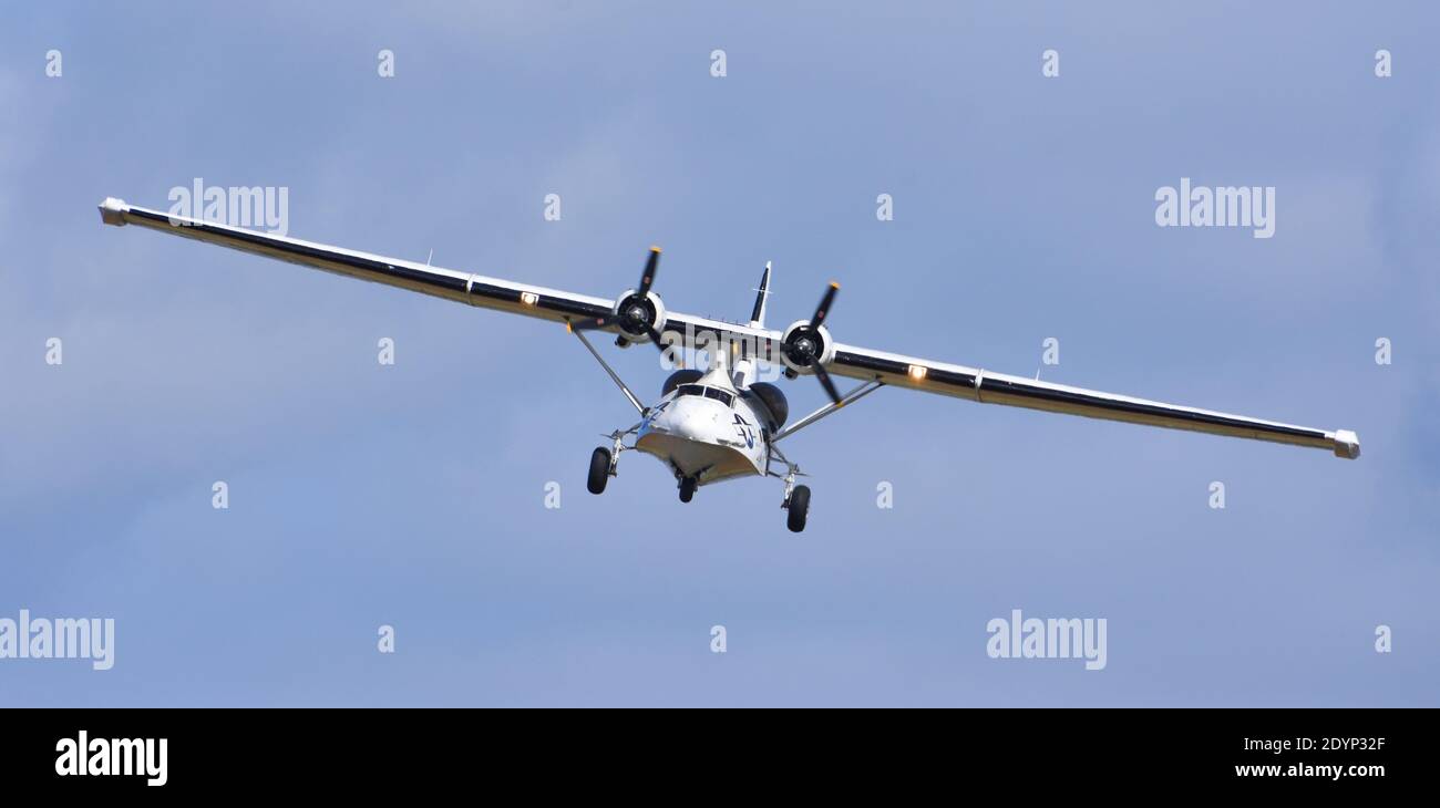 Vintage  PBY-5A Catalina “Miss Pick Up” (G-PBYA) Flying Boat  in Flight. Stock Photo