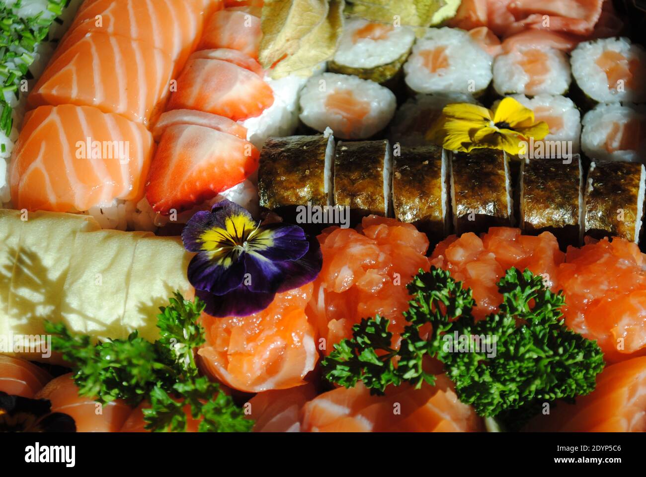 A display of freshly prepared sushi pieces ready to be enjoyed. Stock Photo