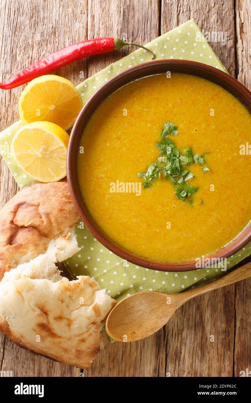 Lebanese Lentil Soup Shorbat Adas closeup in the bowl on the table.  Vertical top view above Stock Photo - Alamy