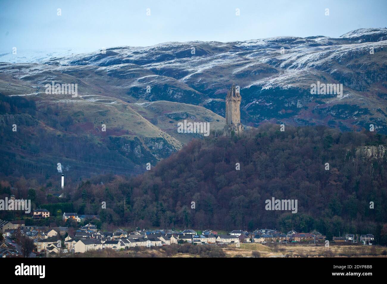 Stirling, Scotland, UK. 27th Dec, 2020. Pictured: Day two of the festive phase 4 lockdown for mainland Scotland. A small window in the weather emerges from the yellow weather warning which was issued as Storm Bella gives snow fall over night leaving a dusting of white on the Ochill Hills. Credit: Colin Fisher/Alamy Live News Stock Photo