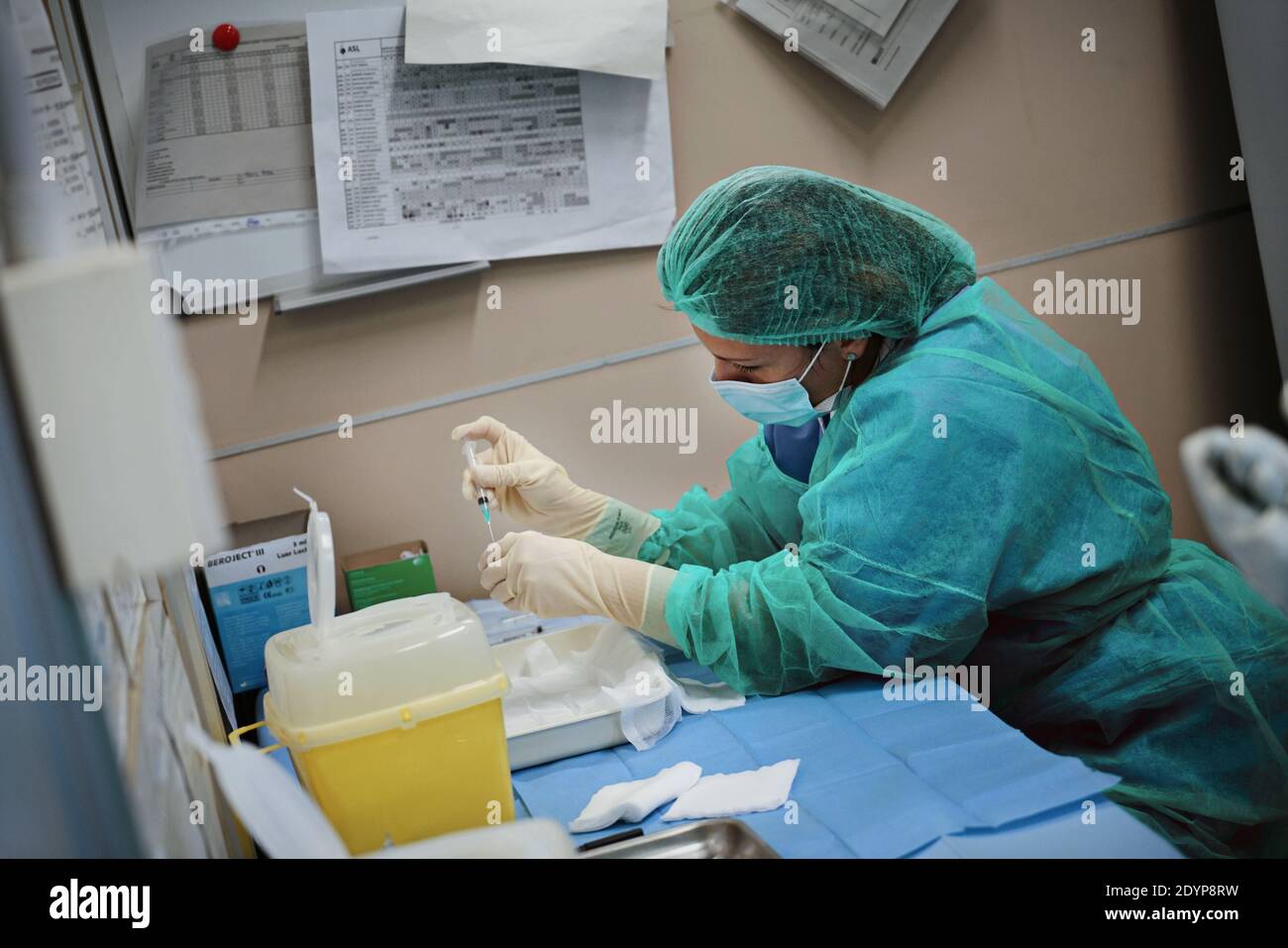 Health workers at work during the first day of the vaccination campaign against COVID 19 at the Amedeo di Savoia Hospital. Turin, Italy - December 27, Stock Photo
