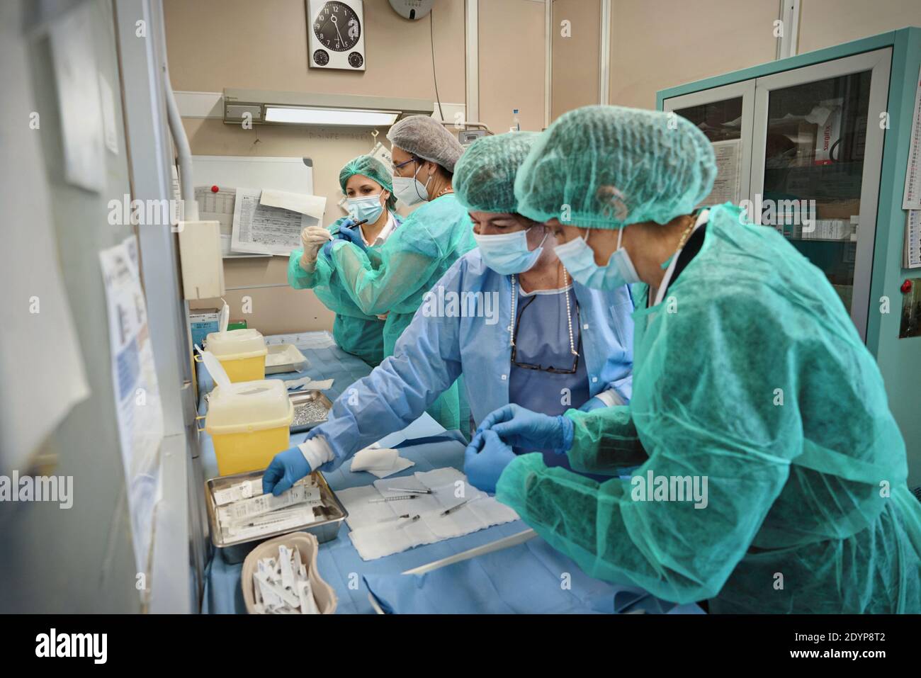 Health workers at work during the first day of the vaccination campaign against COVID 19 at the Amedeo di Savoia Hospital. Turin, Italy - December 27, Stock Photo