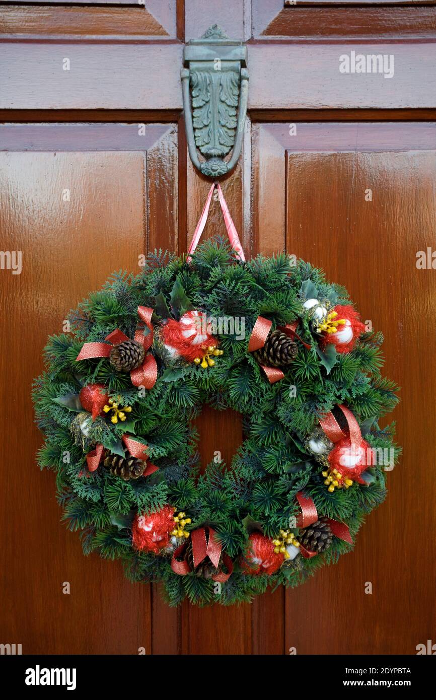 Christmas wreath on wooden front door Stock Photo