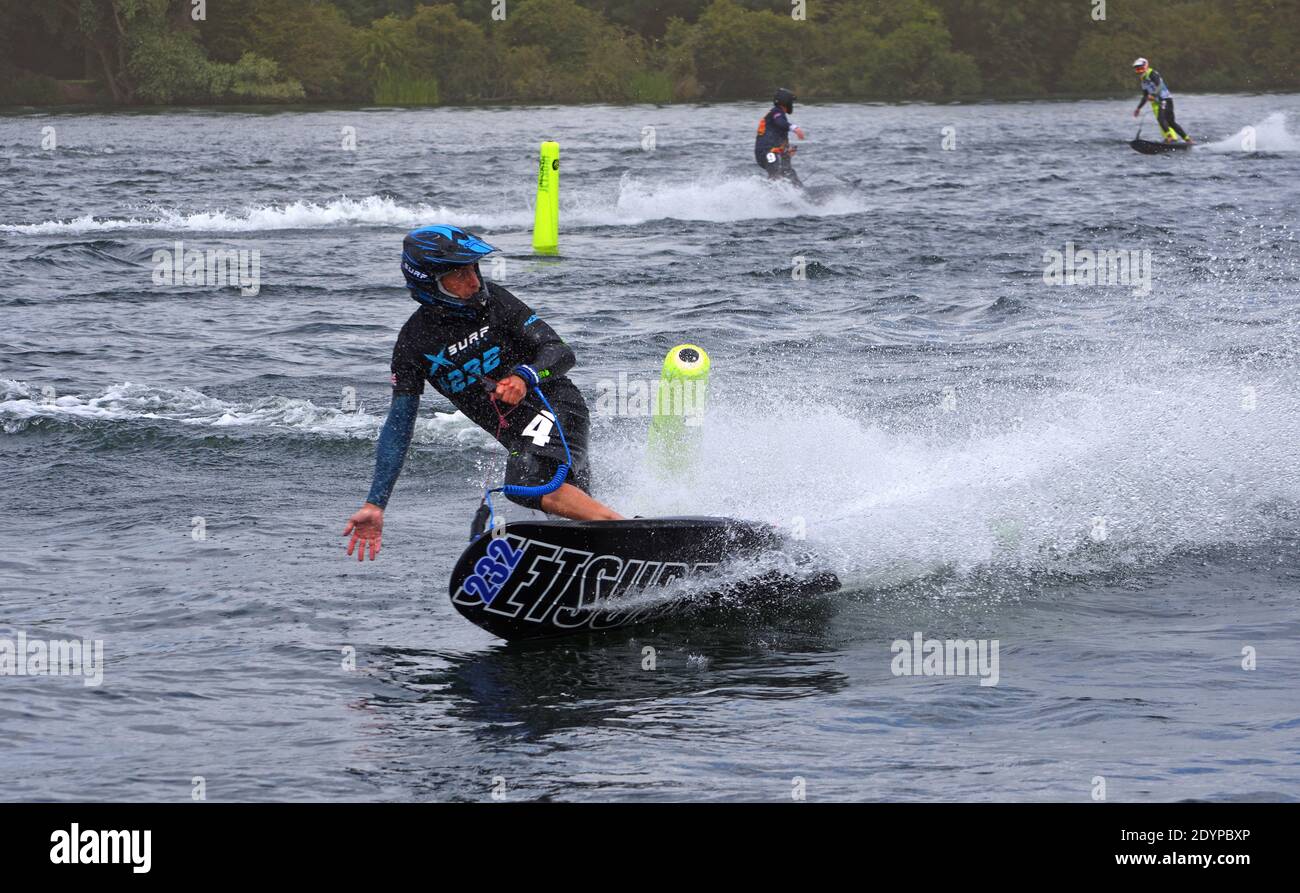 Male Motorsurf Competitor cornering at speed. Stock Photo