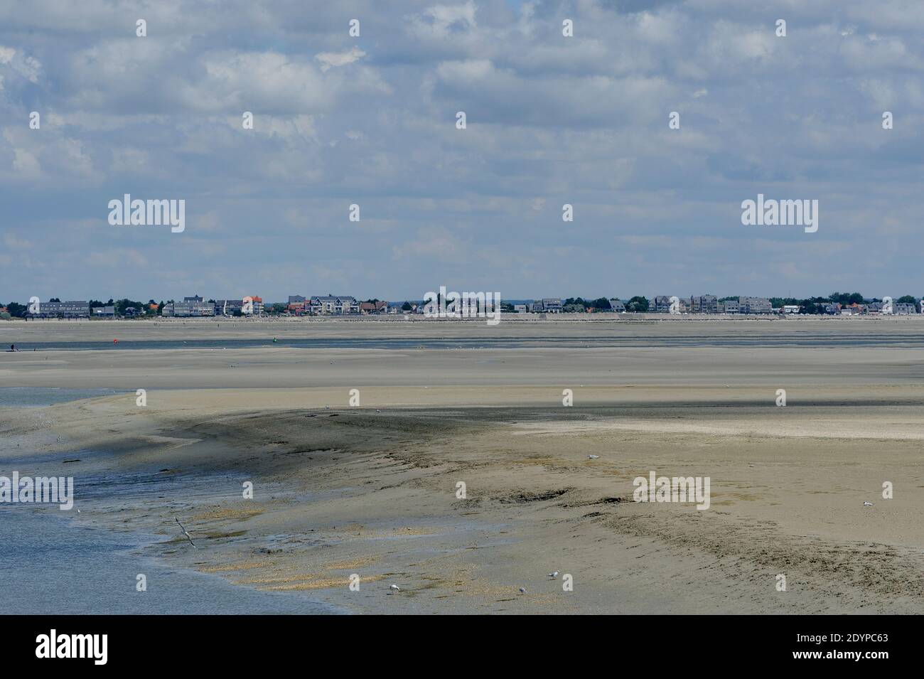Baie de Somme  - Beach under the clouds on the outskirts of the city Le-Treport in the Bay of the Somme in France. Stock Photo