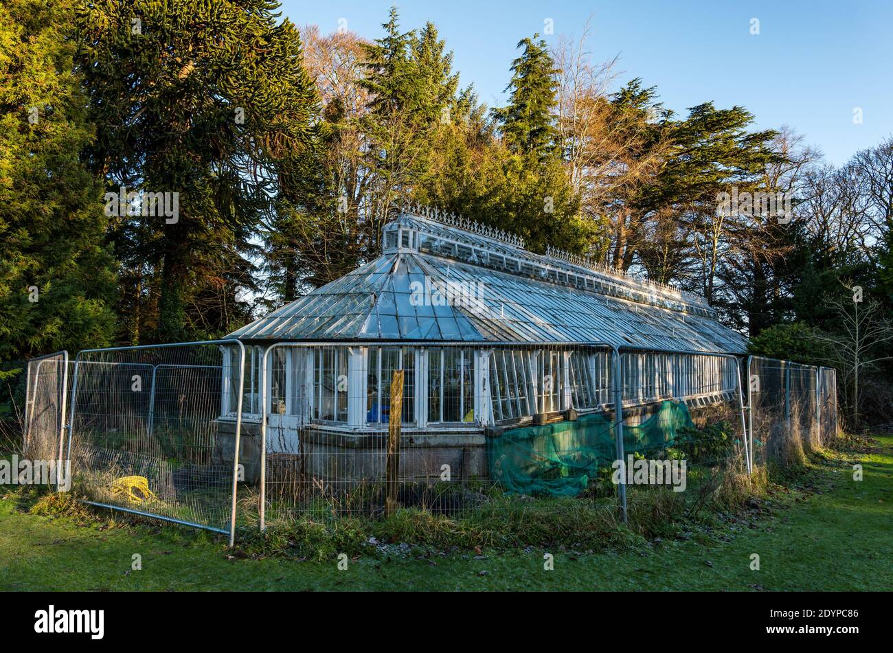 Derelict ornate Victorian conservatory, glasshouse or greenhouse, Lauriston Castle garden, Edinburgh, Scotland, UK Stock Photo