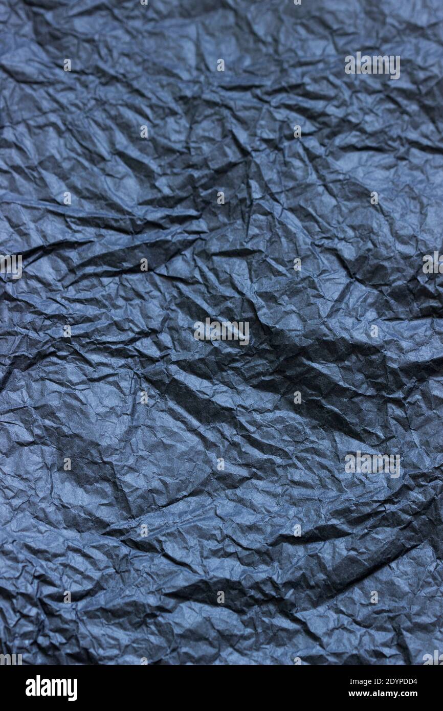 Background from crumpled black or gray paper. Stock Photo