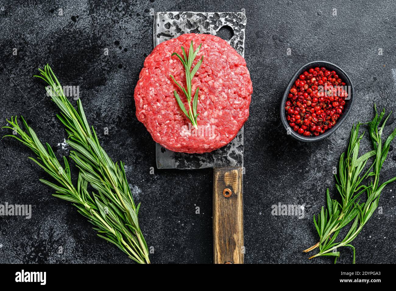 Burger Patty, ground beef meat. Black background. Top view Stock Photo Alamy