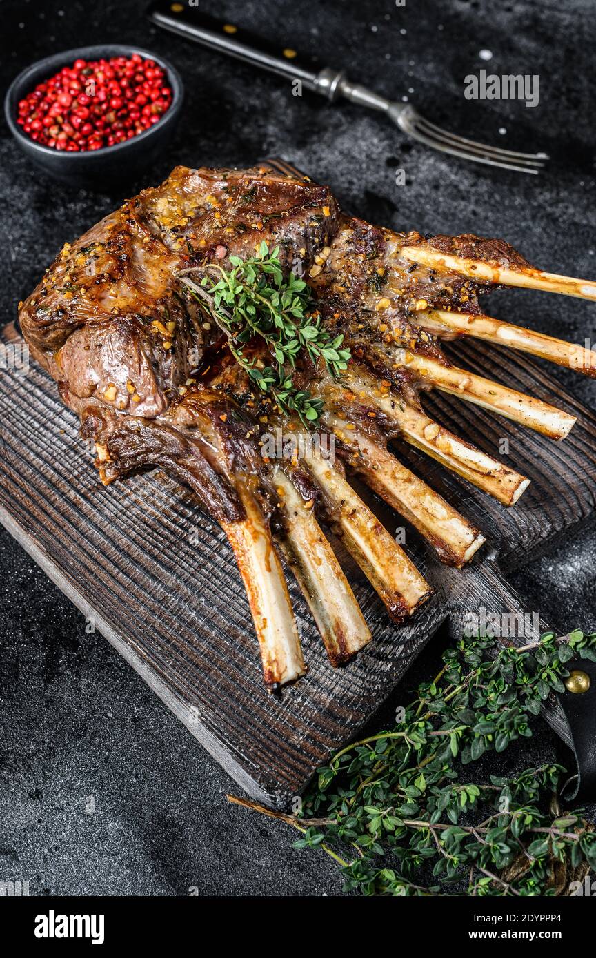 Barbecue rack of lamb meat chops. Black background. Top view Stock