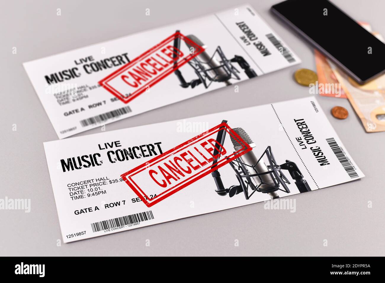 Concept for cancelled entertainment events with concert tickets and red 'cancelled' stamp on them Stock Photo