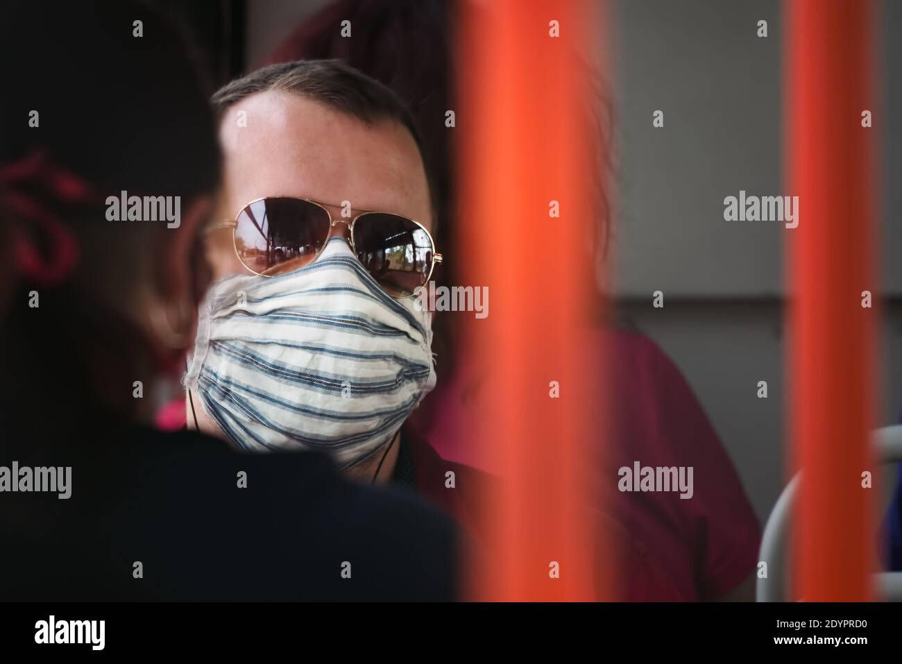 Man wearing mask in public transport hi-res stock photography and ...