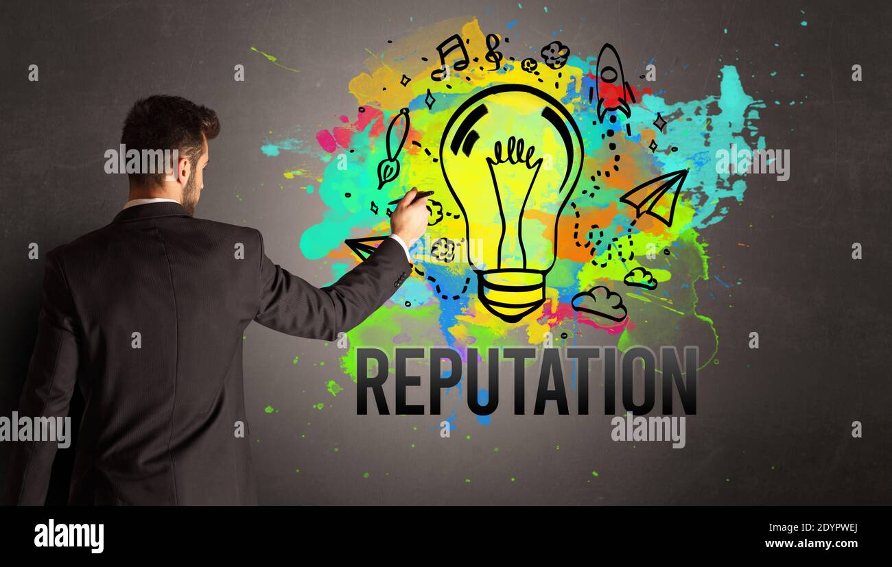 businessman drawing colorful light bulb with REPUTATION inscription on ...
