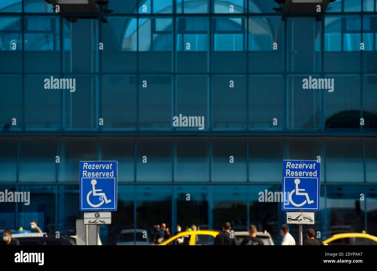 Otopeni, Romania - September 21, 2020: A Reserved Handicapped Parking Sign is seen in the parking of Bucharest Henri Coanda International Airport, i Stock Photo