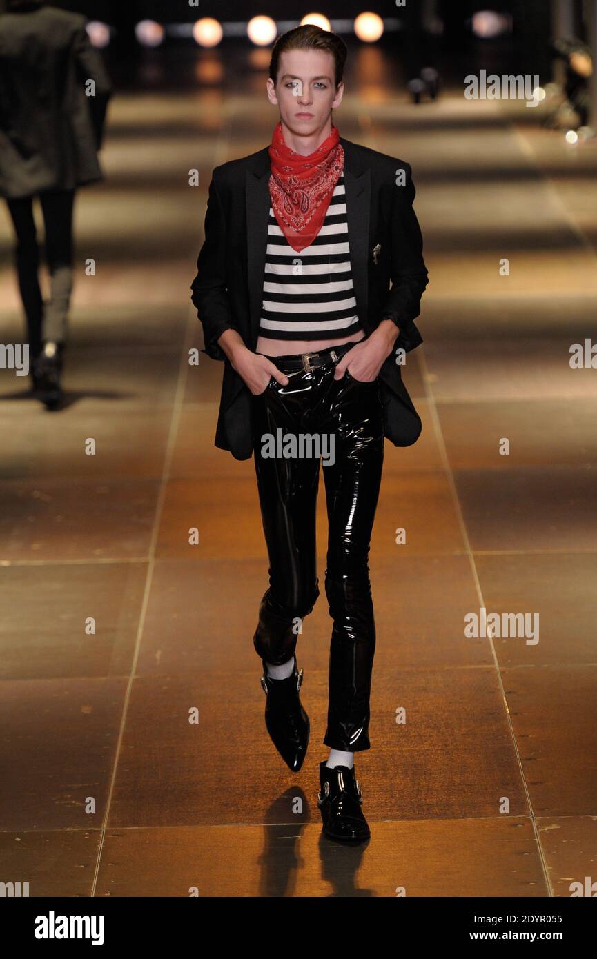 A model displays a creation as part of Yves Saint-Laurent Men