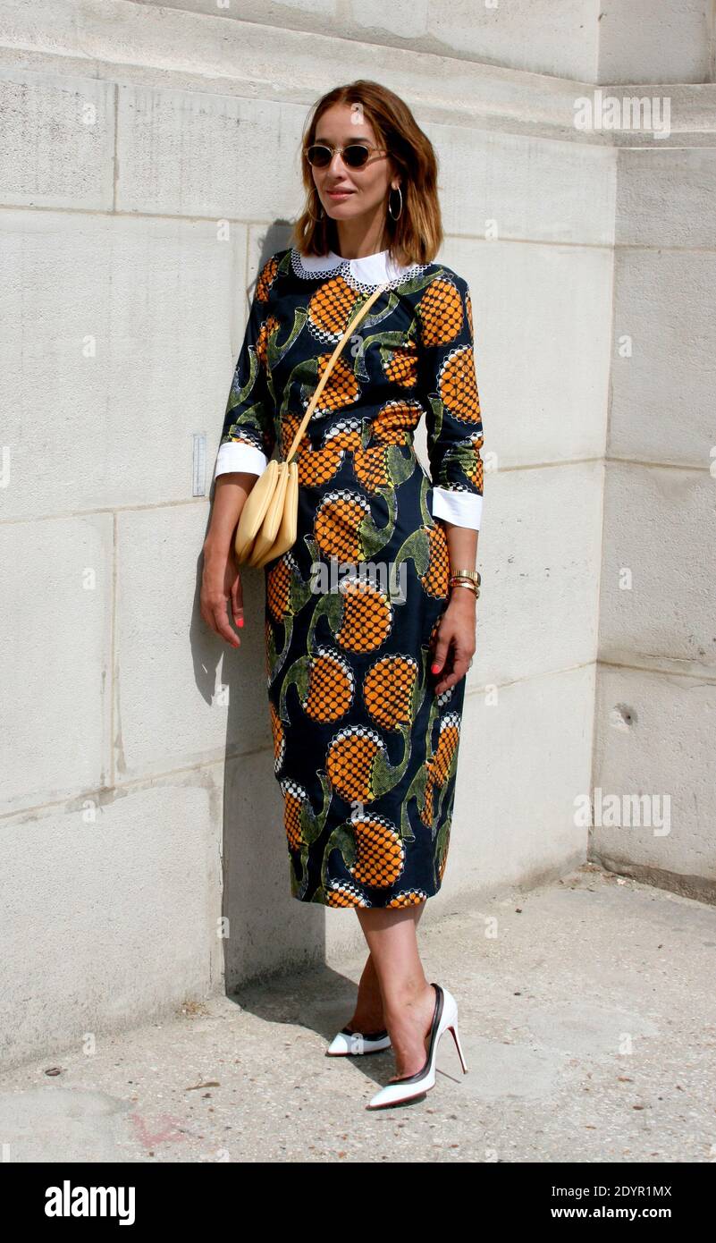 Street Style. A fashionista attends Chanel Fall-Winter 2013-2014 fashion  show at the Grand Palais in Paris, France on July 2nd, 2013. Dunja, a  blogger (styledissection.com), is wearing a Mango jumpsuit, Topshop jewels