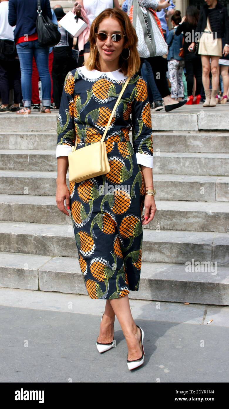 Street Style. A fashionista attends Chanel Fall-Winter 2013-2014 fashion  show at the Grand Palais in Paris, France on July 2nd, 2013. Dunja, a  blogger (styledissection.com), is wearing a Mango jumpsuit, Topshop jewels