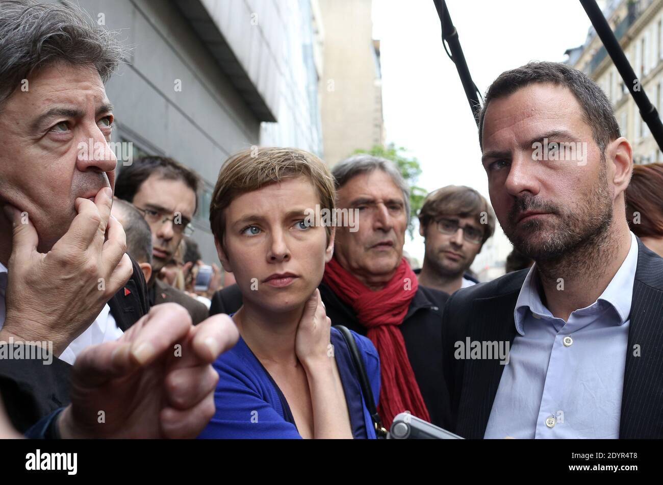 Former French trader Jerome Kerviel flanked by Leader of the left-wing Front de Gauche (Left Front) party, Jean-Luc Melenchon, Clementine Autain leaves the Conseil des Prud'hommes Labour Court where he sues the Societe Generale bank and dispute his dismissal for serious misconduct, in Paris, France on July 4, 2013. Photo by Stephane Lemouton/ABACAPRESS.COM Stock Photo