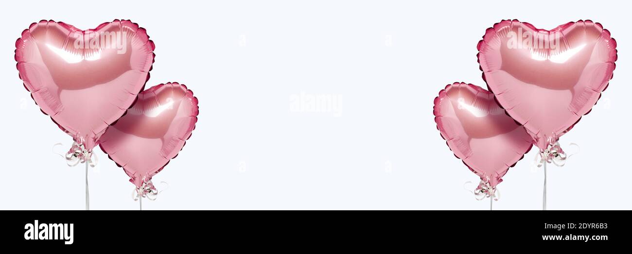 Pink air balloons heart shape on a white background. Concept wedding ...