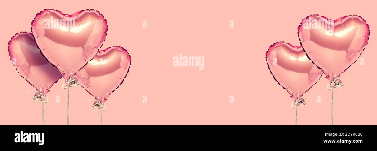 Pink air balloons heart shape on a white background. Concept wedding ...